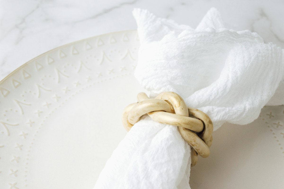 Linen napkin with a gold napkin ring