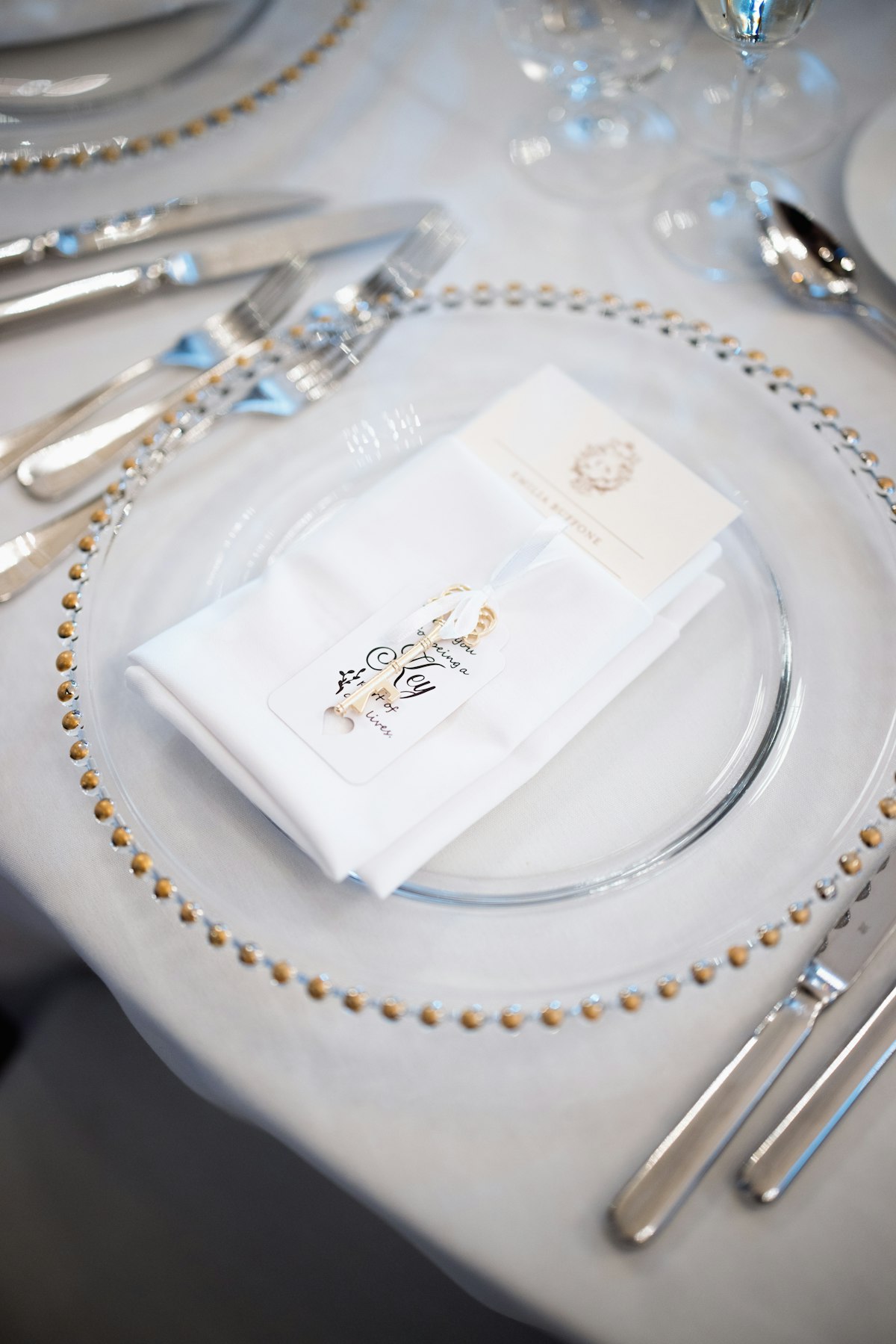 Beaded glass charger with folded napkin