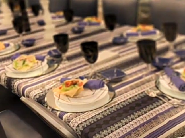 Purple striped tablecloth from the gemach