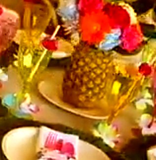 Tropical table with pineapple centerpiece